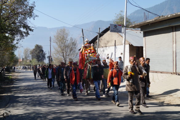 A religious procession on its way to a neighbouring village