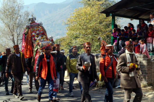 A religious procession on its way to a neighbouring village