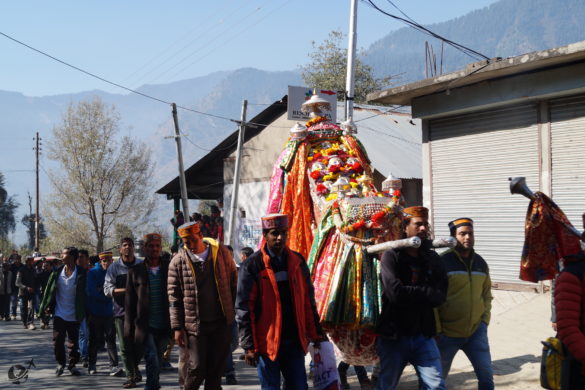 A religious procession on its way to a neighbouring village