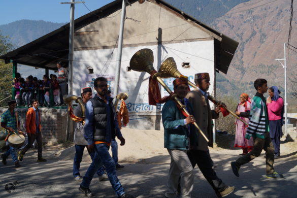 A religious procession on its way to a neighbouring village